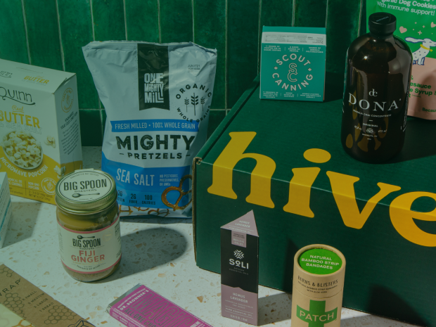 Hive Brands products arranged on a green background