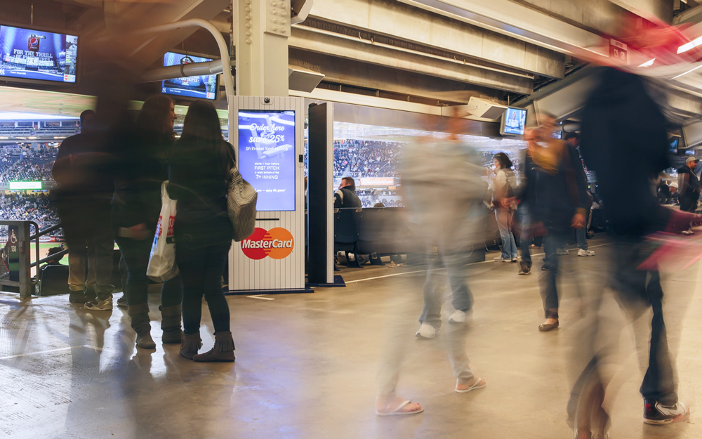 Yankee Stadium concourse and food-ordering kiosks